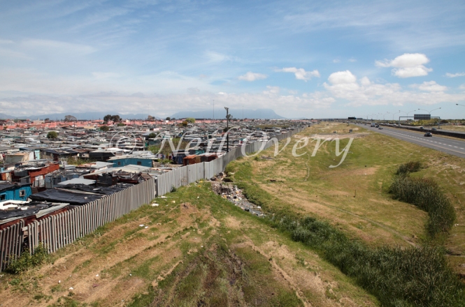 The N2 national road passes the informal settlement (township) of Khayelitsha, Cape Town, South Africa